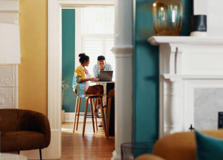 Couple discussing finances together at home – money mindset and budgeting advice from accountant in Motueka